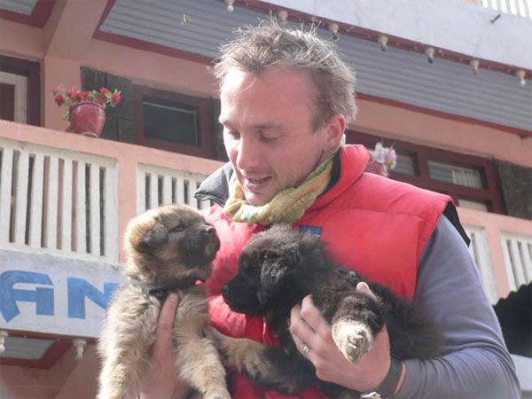 Eric and puppies at Dharapani
